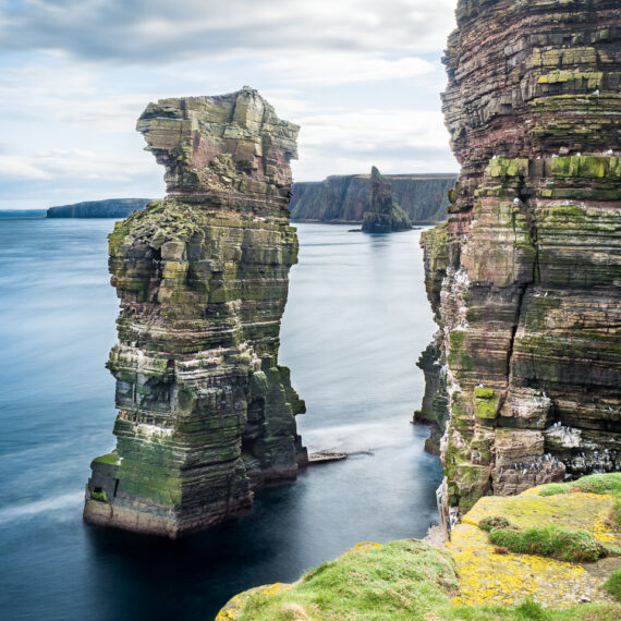 Travel photography Scotland: Sea stacks in the Pentland Firth at Duncansby Head, near John o'Groats, Caithness, Scotland. The stacks are used by seabirds for nesting.