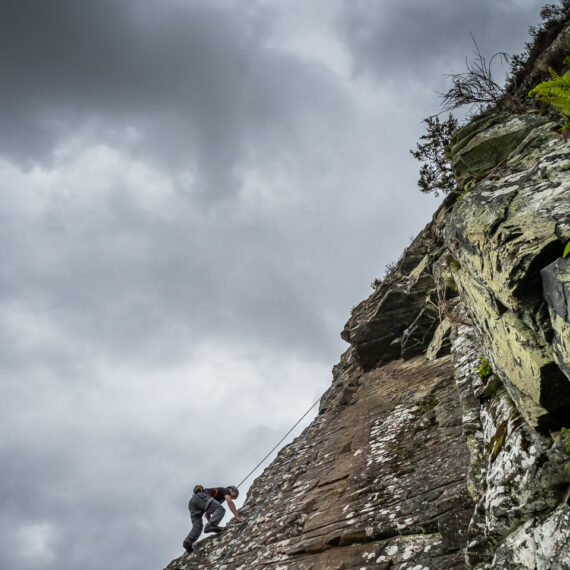Adventure travel photography: Climbers at Kingussie Crag, Cairngorms National Park, Scotland, UK.