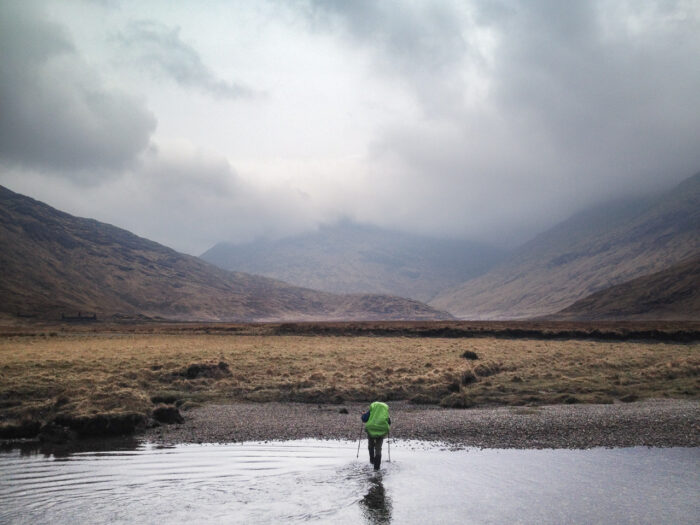 Cape Wrath Trail: Andy Wasley crosses the River Carnach in Knoydart, Scotland, during an attempt on the Cape Wrath Trail. (Image courtesy of Jan-Philipp Kappner.)